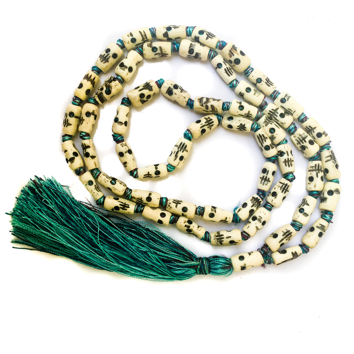 Kali skull hand carved bone half mala necklace with tri-color silk knots and tassel by IndiOdyssey